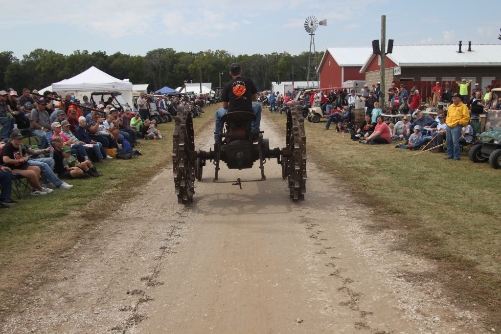 A Farmall F 20 leaves its mark on the parade route at the AETA Working Farm Show.