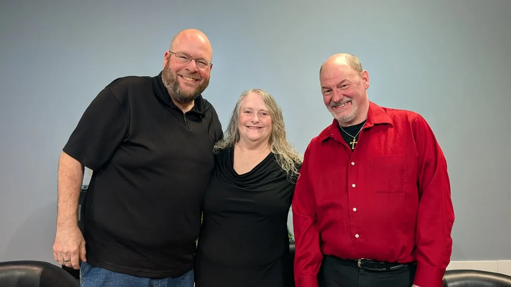 Host Nathan Stahr with Cathy and Jon James of the Dixon Municipal Band.