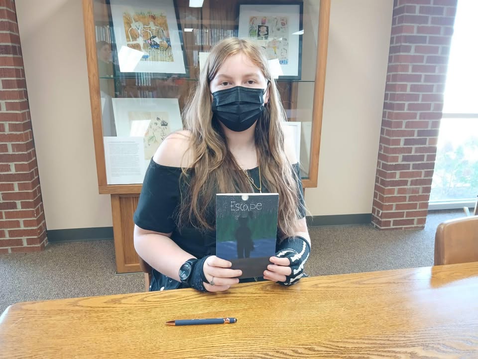 Author Charlotte Stropes donated a copy of her independently published book to the Erie Public Library on Monday afternoon.