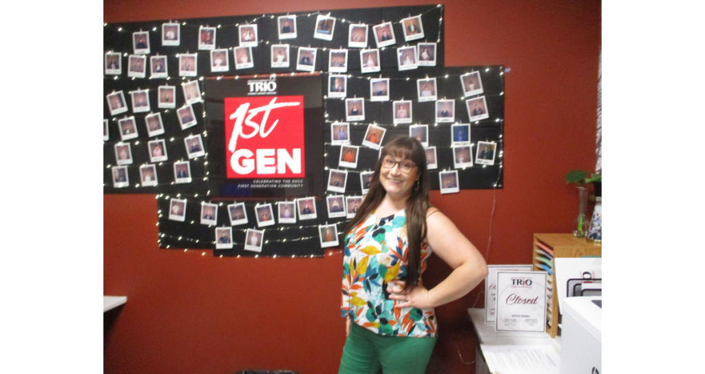 Stephanie Jacobs, Sauk Valley Community College’s Student Support Services project director, stands in front of a picture wall of adults who are going through a special program for first-generation students. Photo by Greg Smith.