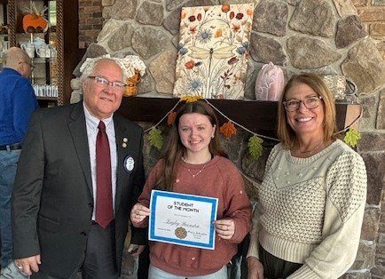Pictured with Zayley are Morrison Rotary President Kevin Schisler and MHS Principal Dr. Dusti Markham.
